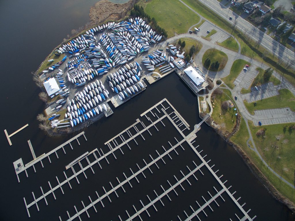 Aerial view of the NSC harbour and Yard with empty docks and the yard packed with boats.