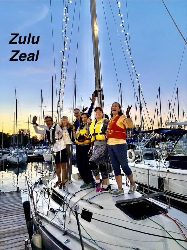 The crew of a sailboat on deck