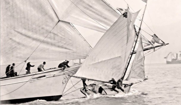 Two sailboats colliding