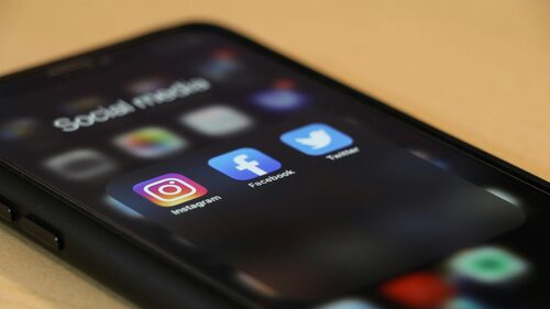 A cellphone displaying social media icons