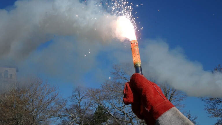 A hand held flare burning