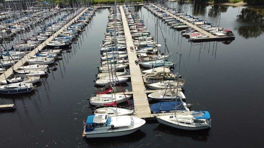 Aerial view of sailboats tied to docs