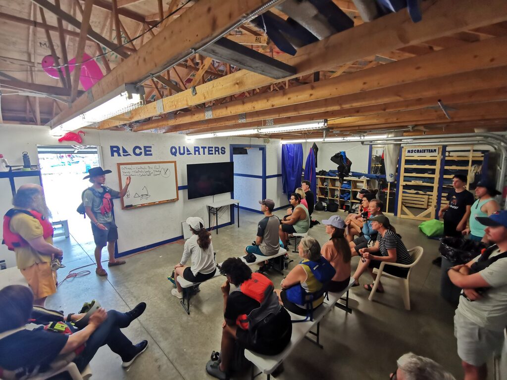 A classroom with a teacher and student sailors