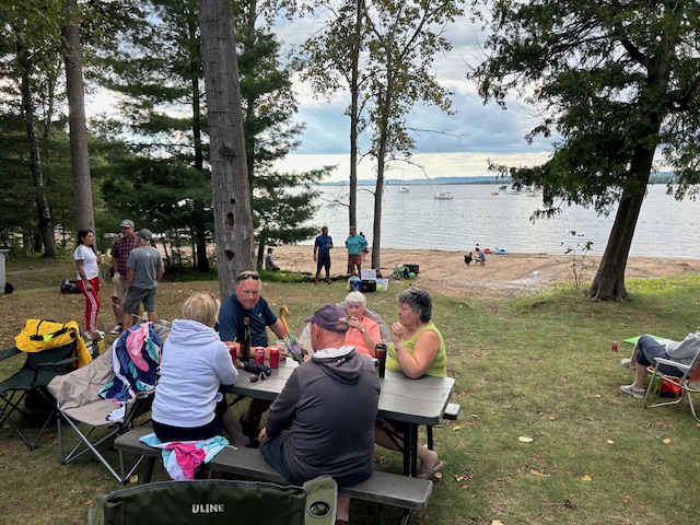 people sitting on a picnic table