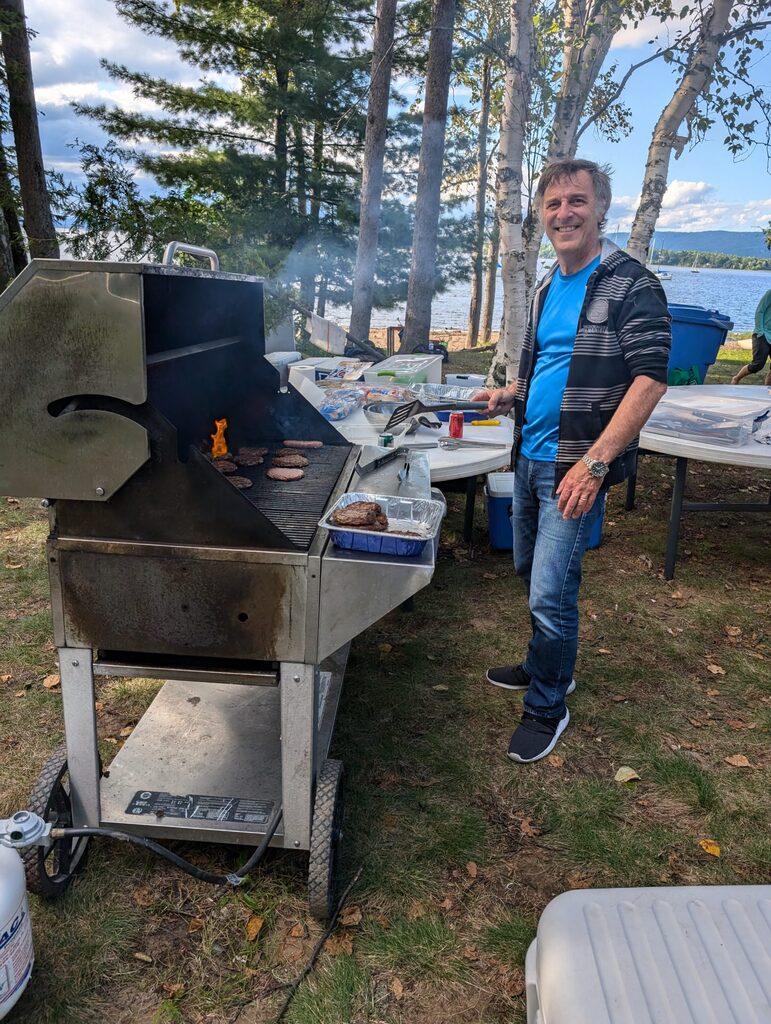 person standing at a bbq