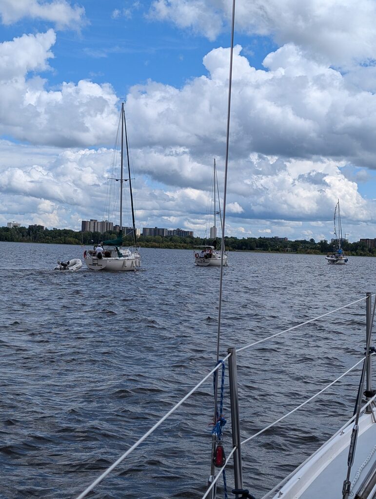 Sailboats motoring in a parage