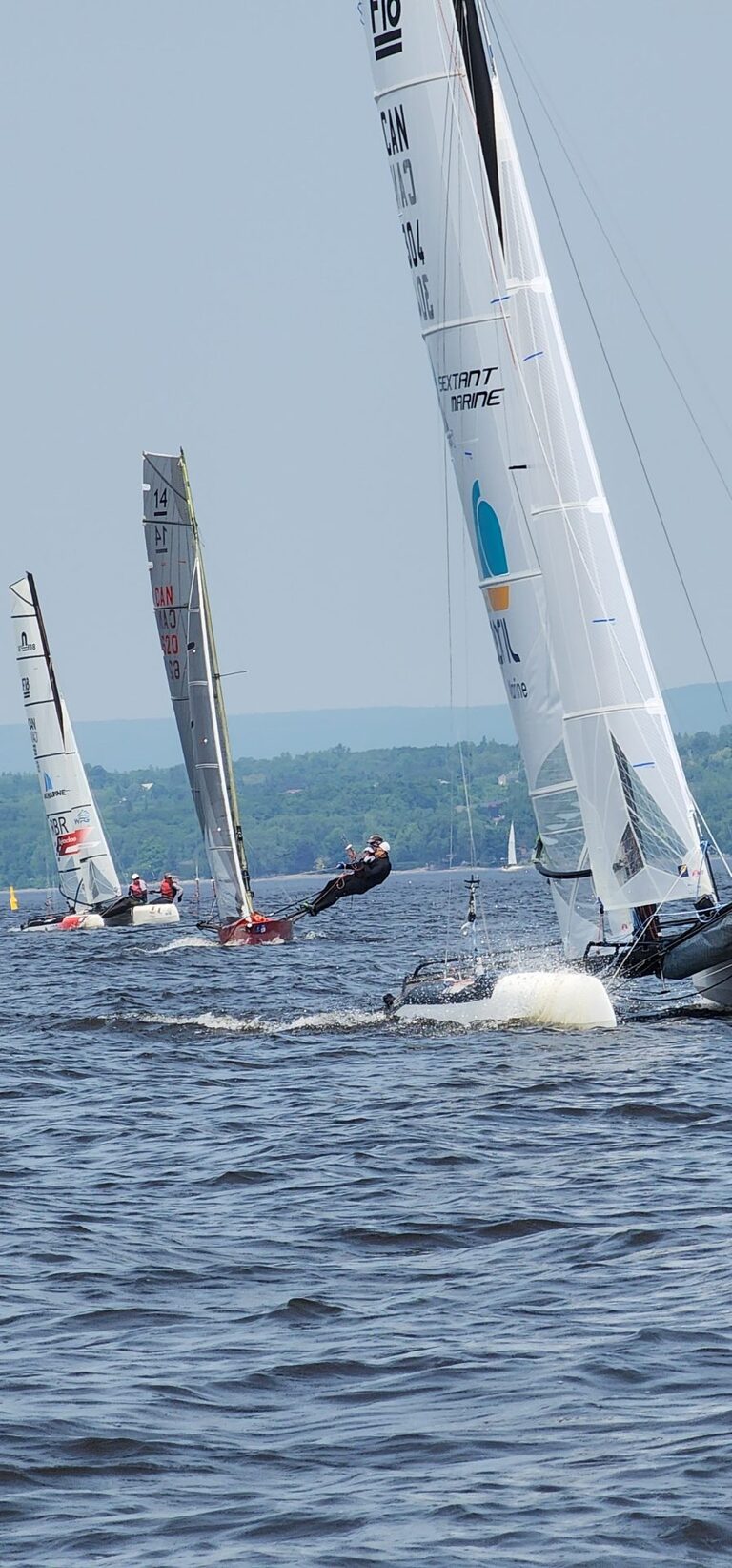 Skiff and Catamarans racing toward the viewer