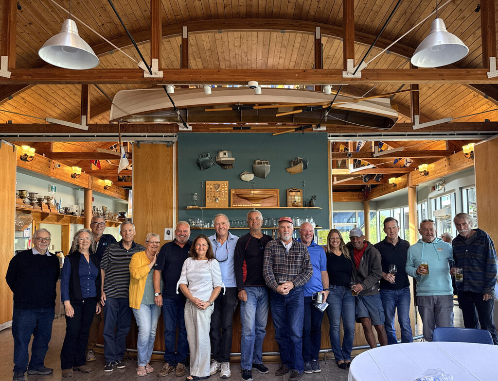 A group of present and former directors in front of the Galley bar